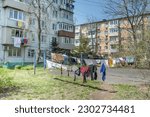 Laundry dries on the rope in courtyard of Khrushchyovka, a common type of old low-cost apartment building in Russia and post-Soviet space. Life in Russia. Russia, Vladivostok.