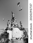 Small photo of Baroque rococo monument erected by the Catholic Society of St. John (Jan) Nepomuk in 1756. At the top of the monument is the statue of St. Mary.