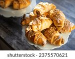 Small photo of St Martin's croissants baked in Poland especially in Poznan in November , put on a blue tray