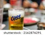 Small photo of Bangkok, Thailand - 8 May 2022: A Glass of Cass Fresh, a lager style beer brewed by Oriental Brewery Co., Ltd in Seoul, South Korea. It's famous for young, mainstream beer drinkers