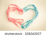 Vintage pink and blue shoelaces of heart.