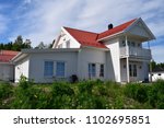 White house with red roof - exterior - sunny season - Norway/Norwegian