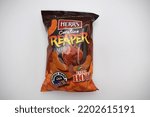 Small photo of Kongsvinger, Norway 16 september 2022: Herr's Carolina Reaper flavored extra hot cheese doodles package salty chips crisps snacks savory food import from america