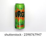 Small photo of Norway 10 december 2023: Original Urge soda tin can with carbs traditional Norwegian soda carbonated citrus soft drink bottle from the Coca Cola company