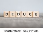 Small photo of DEDUCE word made with building blocks