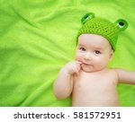 Little Baby In Knitted Frog Hat ...