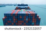 Small photo of Stern of large cargo container ship import export container box on the ocean sea on blue sky back ground concept transportation logistic and service to customer and supply chang