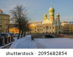 Small photo of View of Saint Isidore's (Isidorovskaya) Church against the background of the Mogilev Bridge over the Griboyedov Canal on a sunny winter day, St. Petersburg. Russia