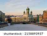 Small photo of View of Saint Isidore's (Isidorovskaya) Church against the background of the Mogilev Bridge over the Griboyedov Canal on a sunny winter day, St. Petersburg, Russia