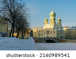 Small photo of View of Saint Isidore's (Isidorovskaya) Church against the background of the Mogilev Bridge over the Griboyedov Canal on a sunny winter day, St. Petersburg. Russia