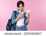 Portrait of young Asian woman student texting message using mobile phone application.College Teenager University concept.