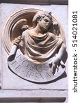 Small photo of Angel in high-relief holding a ribbon with the sentence Â«Nosce Te Ipsumďż˝Â» (Know Thyself) in Trogir, Croatia.