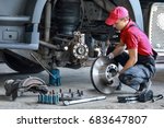 A Mechanic Repairs A Truck....