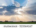 Sun and clouds over corn fields