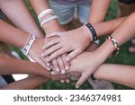 Small photo of Team of children put hands together.Peaceful Protest kids group and protester unity in a fist of diverse people connected together as a nonviolent resistance symbol of justice and fighting