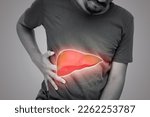 Small photo of The illustration of liver is on the man's body against gray background. A men with hepatitis and fatty liver problem.