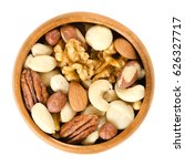 Raw Mixed Nuts In Wooden Bowl....