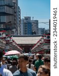Small photo of Tokyo, Japan - July 30, 2023:Lively shopping promenade preceding Asakusa Temple Bursting with traditional stalls, souvenirs, and delectable street food, immersing visitors in vibrant cultural commerce
