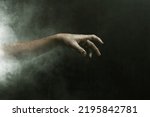 Zombie hand on dark background