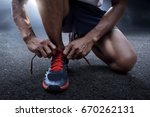 Man Tying Running Shoes