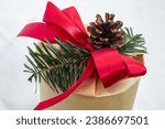 Christmas, New Year gifts. Presents. Beautiful boxes, ribbons and decorations. tree cones on white background. red. craft paper. Holiday. original. cinnamon. candy. Package Design 