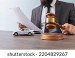Small photo of Model of car and gavel. Accident lawsuit or insurance