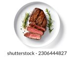 Beef steak served in plate on white background. Grilled steak, medium rare. 