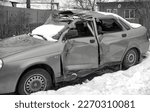 Small photo of Car wrecked and mangled after an accident