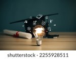 Small photo of E-learning graduate certificate program concept. lightbulb showing graduation hat, and education icons. Internet education course degree, Idea of learning online class.Webinar Online Courses