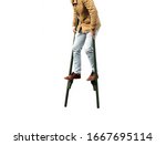 Man walking on stilts isolated...