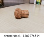 Small photo of Cork cap stopple close up on wood surface