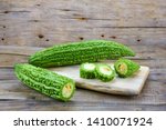               Bitter melon , Bitter gourd isolated on wood background.
                 