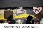 Small photo of Krakow, Poland - February 14 2021: Hand made banners heart shaped with text APOSTASY in Poland and symbolic 8 heart to express dislike for ruling party Law and Justice