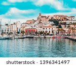 Small photo of Ibiza, Spain ,June 29, 2018.View of the skyline of the old city of Ibiza called Dalt Vila and the port, in turquoise and red tones, on a cloudy day