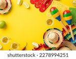 Small photo of Mexican national holiday concept. Top view photo of tequila with salt lime sombrero colorful striped poncho garland and maracas on isolated vibrant yellow background with empty space