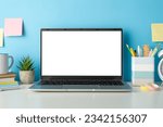 Small photo of Explore the online learning environment with a side view image of a white desk, laptop, small cactus and stationery against an isolated blue background, allowing for text or advertising integration