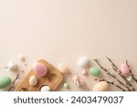 Small photo of Easter joy captured in picturesque frame. Colorful eggs, pussy-willow branches, sweet ceramic bunnies, sprinkles come together on pastel beige backdrop, leaving space for your text or advertisement