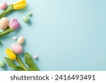 Small photo of Easter Joy Composition: top view colorful eggs, and fresh tulips on a soft blue background. Ideal for greetings or promotions with space for text or ads