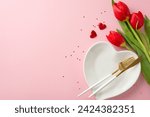 Small photo of Picture-perfect 8 March date tableau, top view perspective of table adornment, heart plate, high-end fork and knife, glitters, hearts, bunch of tulips on soft pink field, leaving margin for text or ad