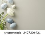 Small photo of Easter aesthetic concept shown through top view slate greyish eggs, a bunny model, gypsophila, tulip, and eucalyptus, all organized on a pastel grey setting, leaving ample space for textual content