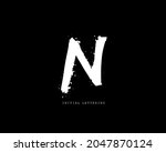 n initial brush handwriting or... | Shutterstock .eps vector #2047870124