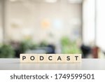 white cubes with podcast inscription on white desk