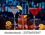 Small photo of thirst quenching cocktails with fresh decorations on counter with bar backdrop, concept