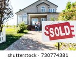 sold house with blurred family on background