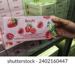 Small photo of Sepang, Malaysia - 2 December 2023 : Hand hold a new boxed of BERYL'S Freeze Dried Strawberry Coated with White Chocolate for sell in BERYL'S Shop at Sepang, Malaysia with selective focus.