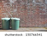 trash can dustbin rubbish bin garbage trashcan can outside against brick wall trash background with copy space - stock photo, stock photograph, image picture 