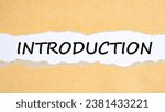 Small photo of Abstract word introduction label torn paper craft scrap box banner on black background. Business important planning introduction concept.