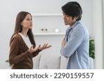 Small photo of Family problems, Asian couple quarrel together at home. woman angry on man and man feel annoy.