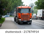 Small photo of RIGA - SEP 8: Scania 114G V8 530 truck on a road on Sep. 8, 2014 in Riga, Latvia. Scania is a major Swedish automotive manufacturer of commercial vehicles - specifically heavy trucks and buses.