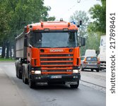 Small photo of RIGA - SEP 8: Scania 114G V8 530 truck on a road on Sep. 8, 2014 in Riga, Latvia. Scania is a major Swedish automotive manufacturer of commercial vehicles - specifically heavy trucks and buses.